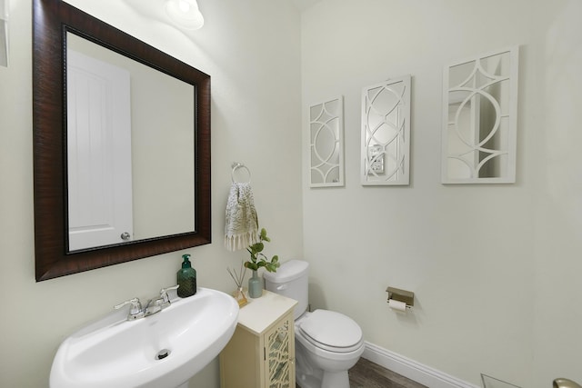 2810 Parkside Village Ln, Pearland, TX 77581 - half bathroom featuring a sink and wood finished floors