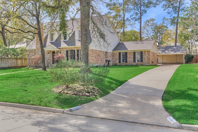 24203 Creekview Dr, Spring, TX 77389 - view of front facade featuring brick siding, concrete driveway, a shingled roof, and a carport