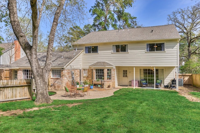 24203 Creekview Dr, Spring, TX 77389 - back of property with a patio area, brick siding, and a shingled roof