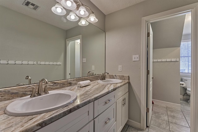 24203 Creekview Dr, Spring, TX 77389 - bathroom with double vanity and tile patterned flooring