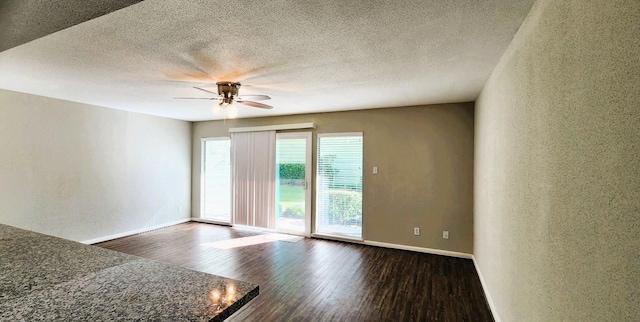 14777 Wunderlich Dr Unit 605, Houston, TX 77069 - empty room with dark wood-type flooring, a ceiling fan, and a textured ceiling