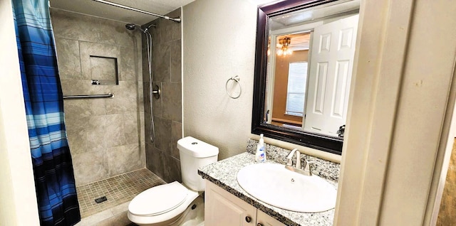 14777 Wunderlich Dr Unit 605, Houston, TX 77069 - full bath featuring a tile shower, a textured wall, and vanity