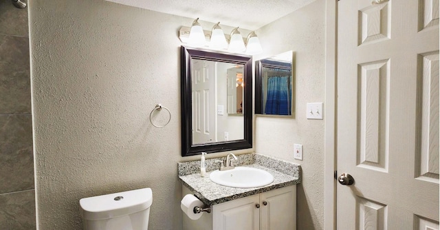 14777 Wunderlich Dr Unit 605, Houston, TX 77069 - bathroom featuring vanity and a textured wall