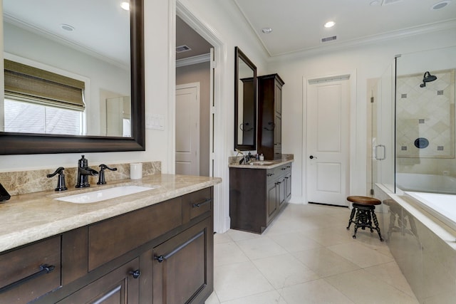 5218 Crawford St, Houston, TX 77004 - bathroom featuring a stall shower, a tub to relax in, two vanities, ornamental molding, and tile patterned flooring