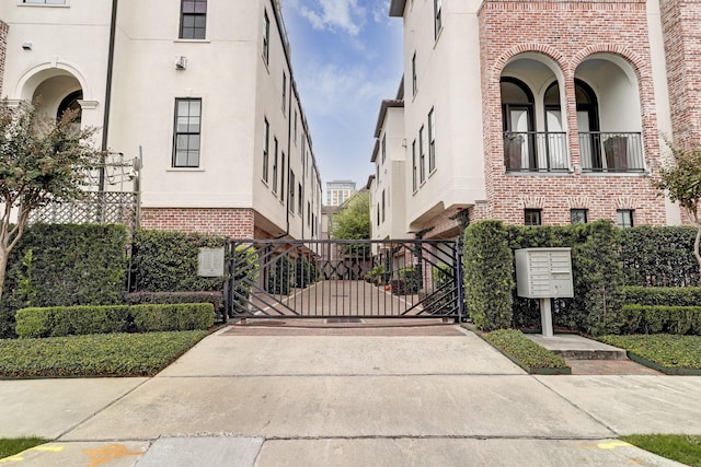 5218 Crawford St, Houston, TX 77004 - view of concrete driveway with a gate and a gated entry