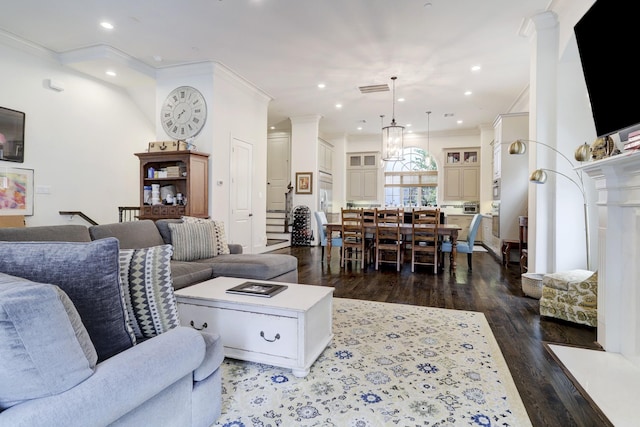 5218 Crawford St, Houston, TX 77004 - living area featuring dark wood-style floors, ornamental molding, and recessed lighting