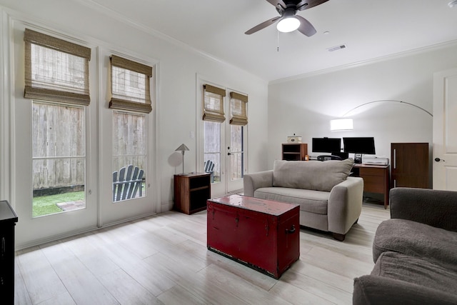 5218 Crawford St, Houston, TX 77004 - living area featuring french doors, crown molding, plenty of natural light, ceiling fan, and an office area