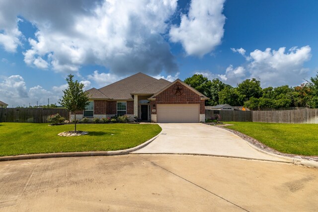 1803 Twin Oaks Cir, Brenham, TX 77833 - view of front of home featuring brick siding, an attached garage, and concrete driveway