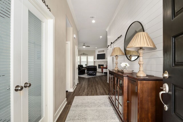 1803 Twin Oaks Cir, Brenham, TX 77833 - hall with crown molding and dark wood-style flooring