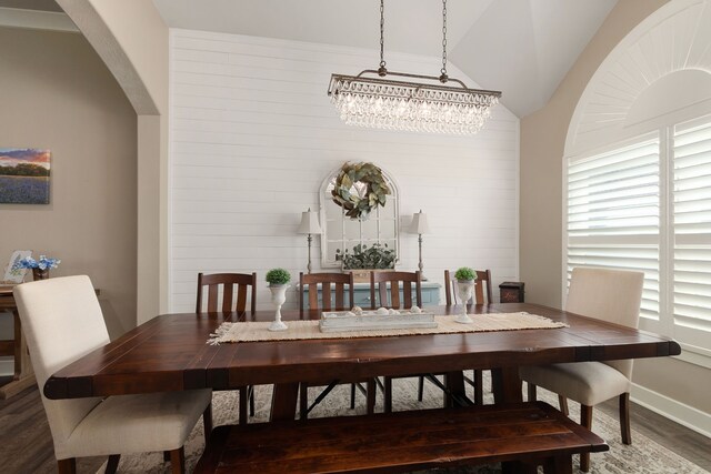 1803 Twin Oaks Cir, Brenham, TX 77833 - dining space with wood finished floors, vaulted ceiling, and arched walkways