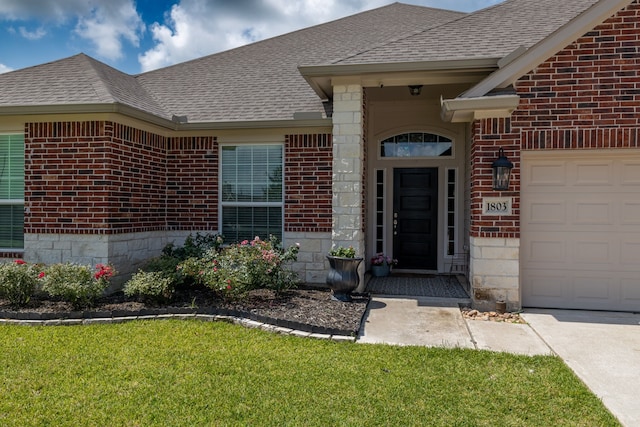 1803 Twin Oaks Cir, Brenham, TX 77833 - property entrance featuring brick siding, roof with shingles, and an attached garage