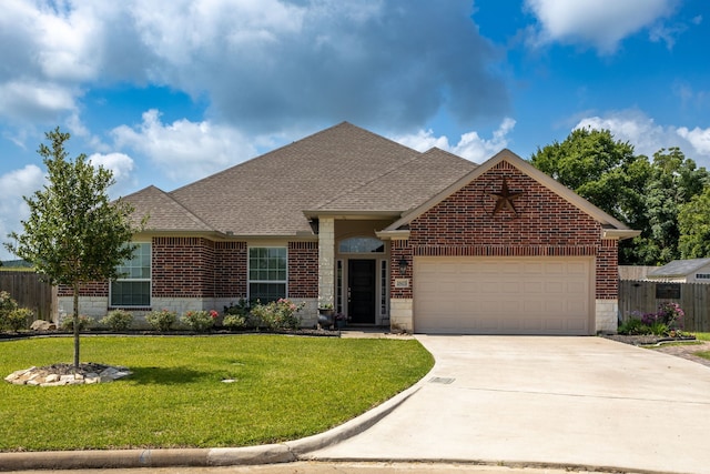 1803 Twin Oaks Cir, Brenham, TX 77833 - view of front of property featuring a garage, brick siding, driveway, and a shingled roof