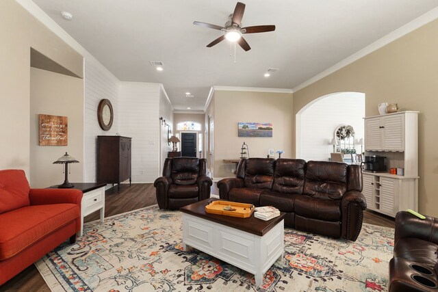 1803 Twin Oaks Cir, Brenham, TX 77833 - living room with light wood-style flooring, crown molding, arched walkways, ceiling fan, and recessed lighting