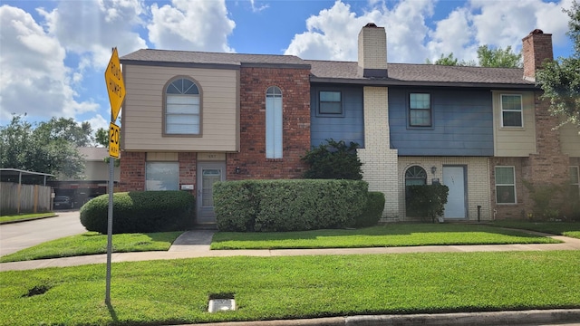 1557 Bonanza Rd Unit 557, Houston, TX 77062 - multi unit property featuring brick siding, a front lawn, and a chimney
