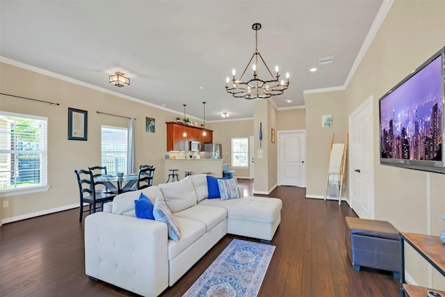 607 29th St, Dickinson, TX 77539 - living room with a chandelier, dark wood-style floors, recessed lighting, and ornamental molding