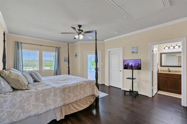 607 29th St, Dickinson, TX 77539 - bedroom with attic access, dark wood-style floors, ornamental molding, access to outside, and connected bathroom