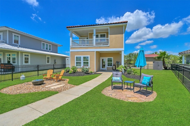 607 29th St, Dickinson, TX 77539 - back of property with a balcony, a patio, a fenced backyard, and stucco siding