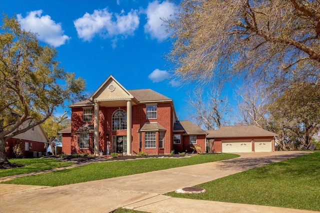 210 River Oaks Dr, Lake Jackson, TX 77566 - greek revival house with a front yard, driveway, brick siding, and an attached garage