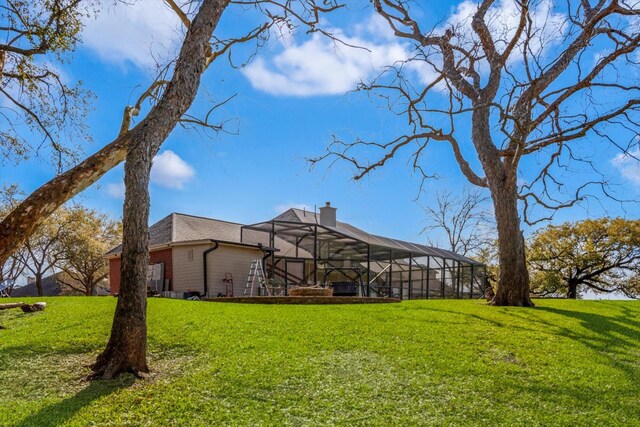 210 River Oaks Dr, Lake Jackson, TX 77566 - view of green lawn featuring glass enclosure