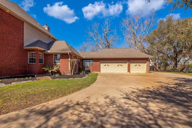 210 River Oaks Dr, Lake Jackson, TX 77566 - view of front of property with concrete driveway, an attached garage, brick siding, and a chimney