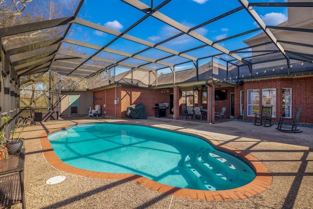 210 River Oaks Dr, Lake Jackson, TX 77566 - swimming pool featuring a patio area, glass enclosure, and grilling area