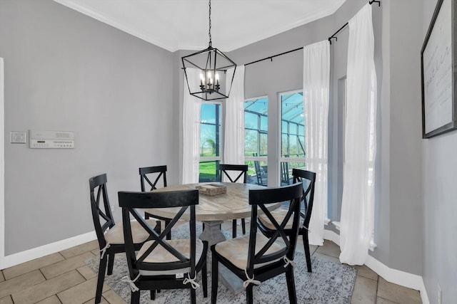 210 River Oaks Dr, Lake Jackson, TX 77566 - dining area with a chandelier and crown molding