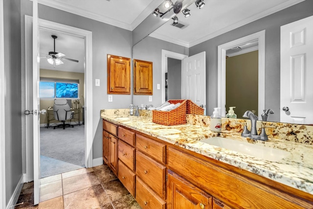 210 River Oaks Dr, Lake Jackson, TX 77566 - bathroom with double vanity, a ceiling fan, and crown molding