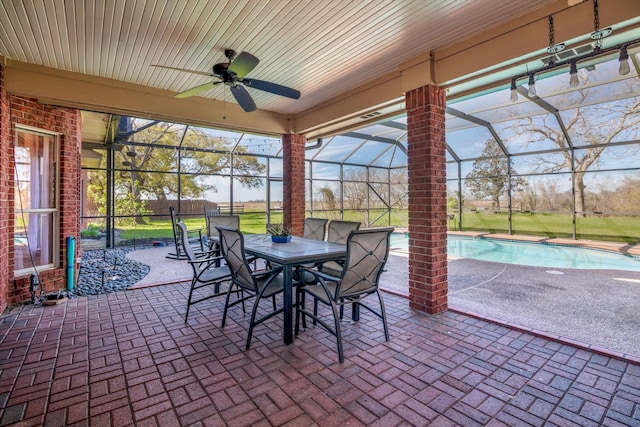 210 River Oaks Dr, Lake Jackson, TX 77566 - view of patio / terrace with an outdoor pool, a ceiling fan, glass enclosure, and outdoor dining space