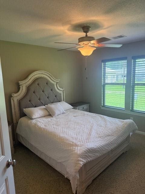 240 Rosalie St, Shepherd, TX 77371 - bedroom featuring carpet, ceiling fan, and a textured ceiling