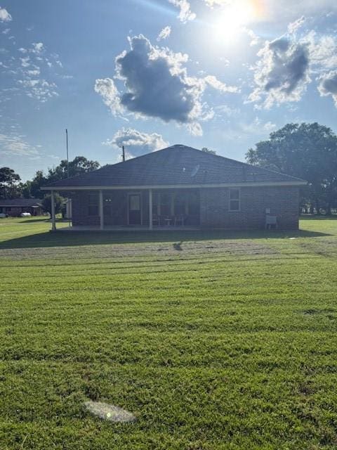 240 Rosalie St, Shepherd, TX 77371 - rear view of property featuring a lawn