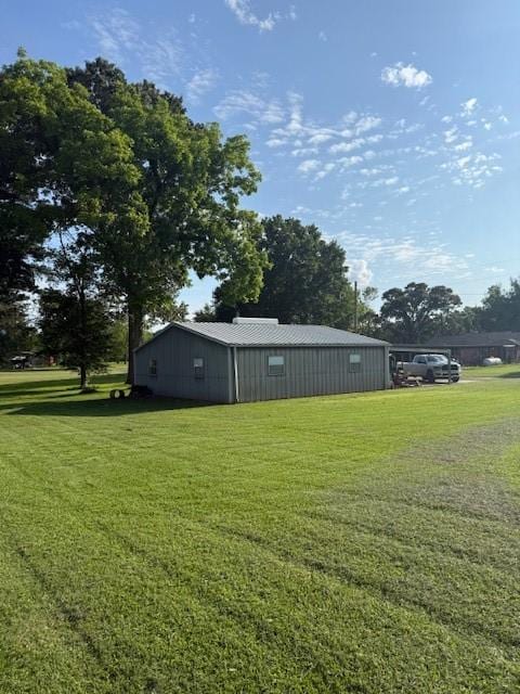 240 Rosalie St, Shepherd, TX 77371 - view of grassy yard featuring an outbuilding
