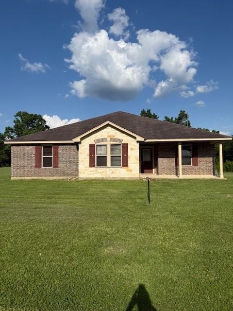 240 Rosalie St, Shepherd, TX 77371 - single story home featuring a front lawn and stone siding