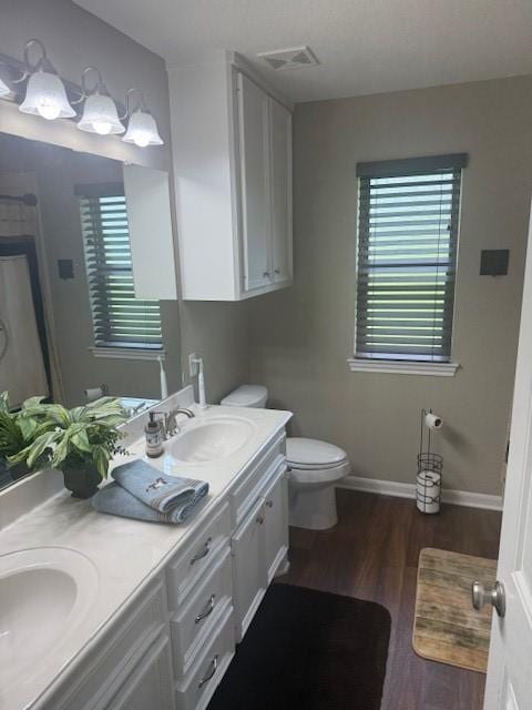 240 Rosalie St, Shepherd, TX 77371 - full bathroom featuring double vanity and wood finished floors