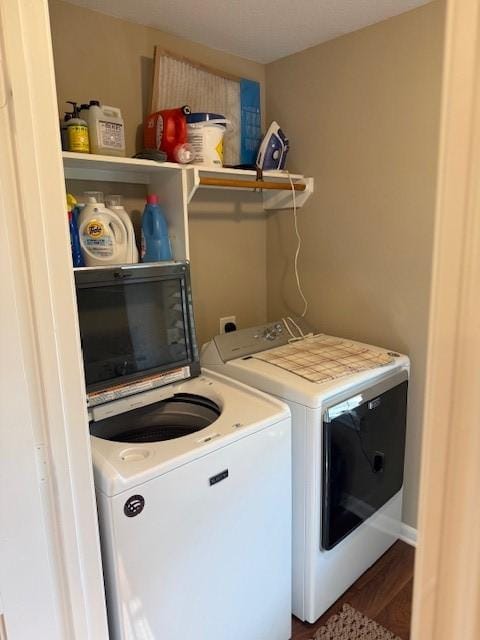 240 Rosalie St, Shepherd, TX 77371 - laundry room with washer and clothes dryer and wood finished floors