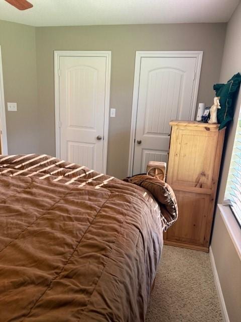 240 Rosalie St, Shepherd, TX 77371 - carpeted bedroom with baseboards and a ceiling fan