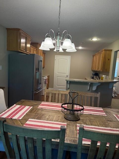 240 Rosalie St, Shepherd, TX 77371 - dining area featuring a chandelier