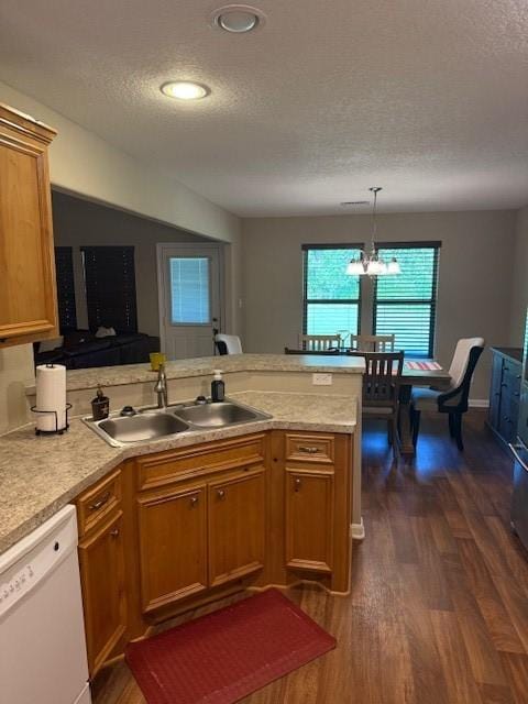 240 Rosalie St, Shepherd, TX 77371 - kitchen with dishwasher, a peninsula, a textured ceiling, dark wood-style flooring, and light countertops
