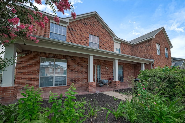 11107 Camino Oaks Dr, Houston, TX 77064 - back of property featuring a porch and brick siding