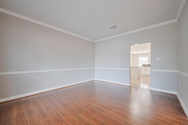 11107 Camino Oaks Dr, Houston, TX 77064 - unfurnished room featuring crown molding and light wood finished floors