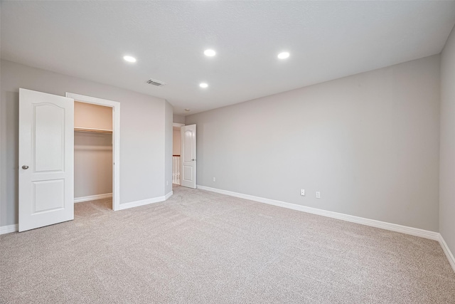 11107 Camino Oaks Dr, Houston, TX 77064 - unfurnished bedroom featuring light colored carpet, recessed lighting, a walk in closet, and a closet