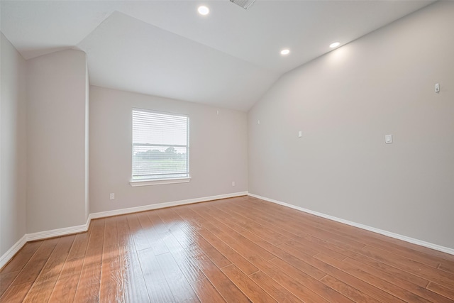 11107 Camino Oaks Dr, Houston, TX 77064 - empty room featuring vaulted ceiling, light wood-style flooring, and recessed lighting