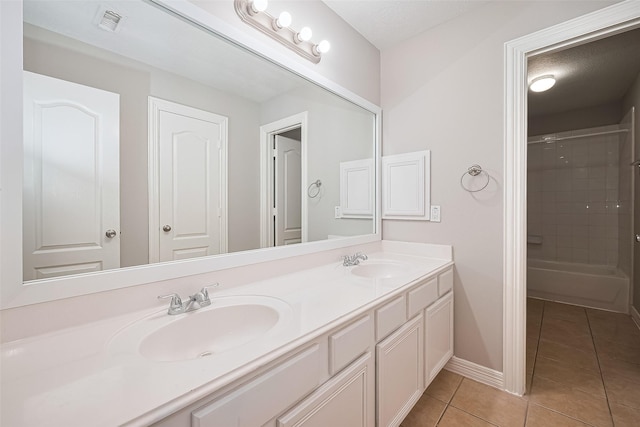 11107 Camino Oaks Dr, Houston, TX 77064 - bathroom with double vanity, tile patterned floors, and a shower