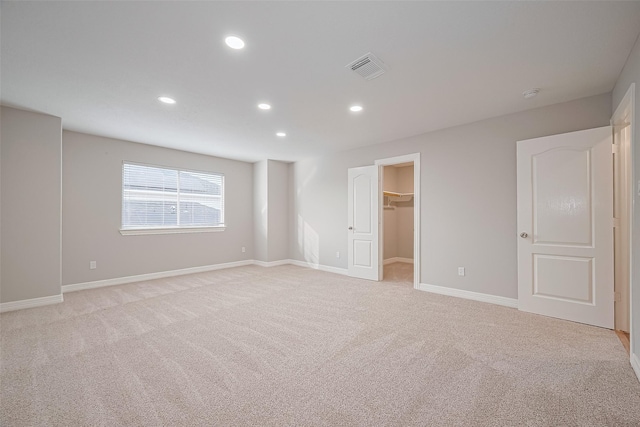 11107 Camino Oaks Dr, Houston, TX 77064 - unfurnished bedroom featuring light carpet, recessed lighting, and a spacious closet