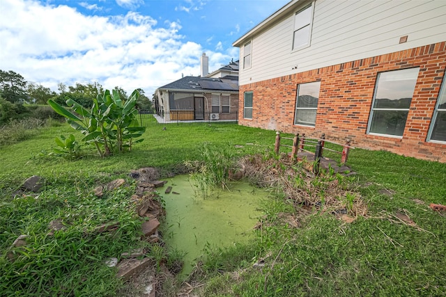 11107 Camino Oaks Dr, Houston, TX 77064 - view of green lawn featuring a sunroom