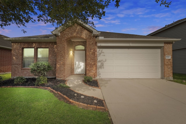 506 Mornington Ln, Katy, TX 77494 - view of front of home with brick siding, driveway, a garage, and a front lawn