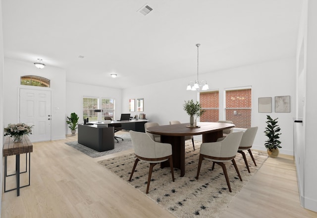 506 Mornington Ln, Katy, TX 77494 - dining room with light wood-style flooring, a chandelier, and a desk