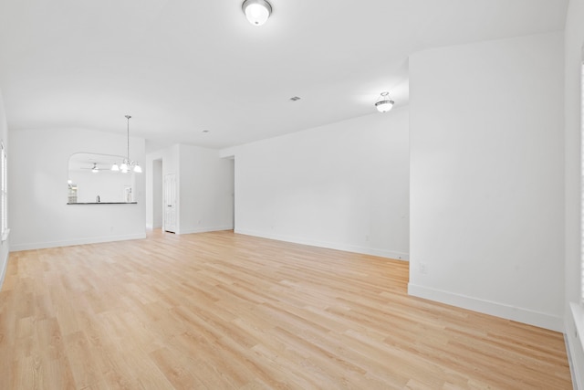 506 Mornington Ln, Katy, TX 77494 - unfurnished living room with a chandelier and light wood-style floors