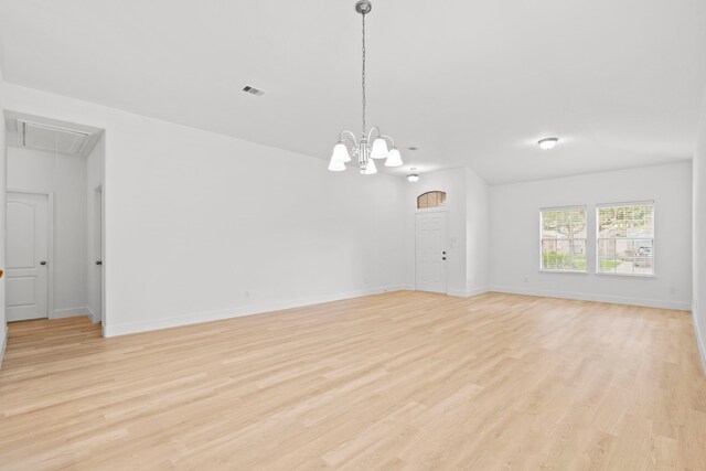 506 Mornington Ln, Katy, TX 77494 - empty room with attic access, light wood finished floors, and a chandelier
