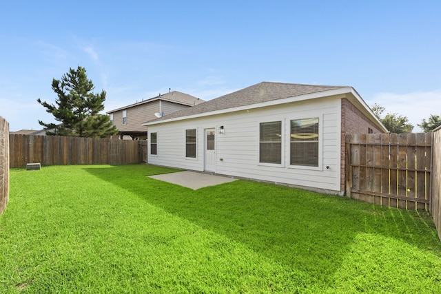 506 Mornington Ln, Katy, TX 77494 - back of property with a fenced backyard, a patio area, and roof with shingles