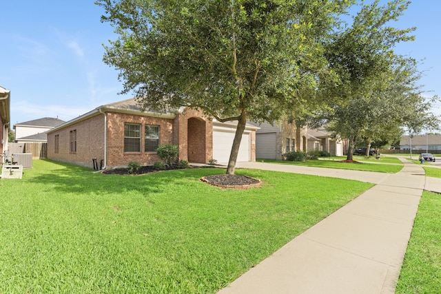 506 Mornington Ln, Katy, TX 77494 - view of front of house with brick siding, a front lawn, concrete driveway, and an attached garage